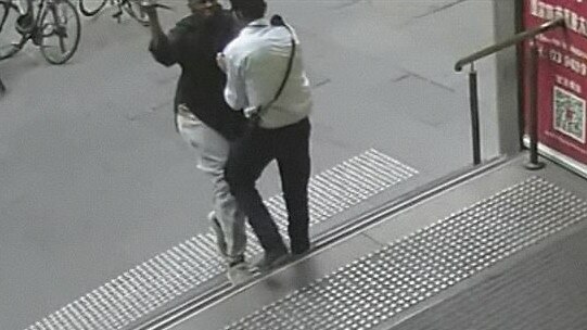 CCTV footage shows Shadi being stabbed in the neck on the front steps of the Bourke St building. Picture: Nine News