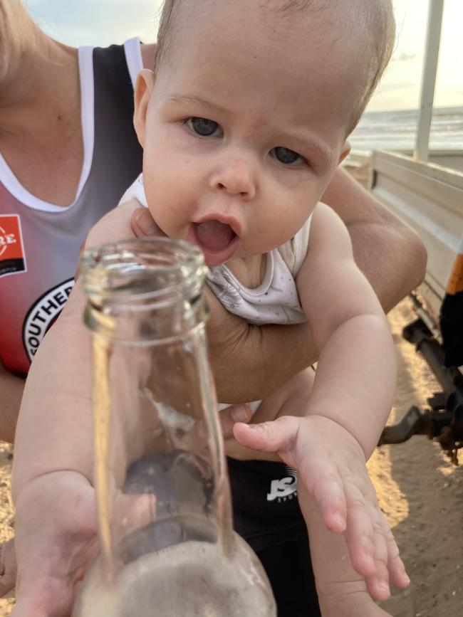 Oscar Waldegrave at Gunn Point for his first beach trip. Like a true Territorian, he knows what’s good for him! Picture: Chantal Jennison