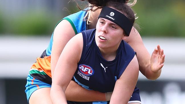 BRISBANE, AUSTRALIA - JULY 02: Ava Jordan of Vic Metro handballs during the 2023 AFL National Championships U18 Girls match between Allies and Vic Metro at Brighton Homes Arena on July 02, 2023 in Brisbane, Australia. (Photo by Chris Hyde/AFL Photos/via Getty Images )