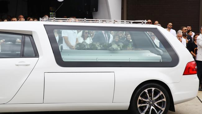 The three small caskets arrive at the cathedral on Monday morning. Picture: Matrix