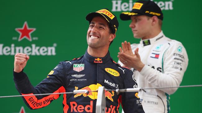 SHANGHAI, CHINA — APRIL 15: Race winner Daniel Ricciardo of Australia and Red Bull Racing celebrates on the podium during the Formula One Grand Prix of China at Shanghai International Circuit on April 15, 2018 in Shanghai, China. (Photo by Clive Mason/Getty Images)