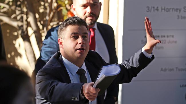 Auctioneer Emanuel Comino at the recent sale of a Marrickville home. Auction clearance rates have recently been improving. Picture: Tim Hunter