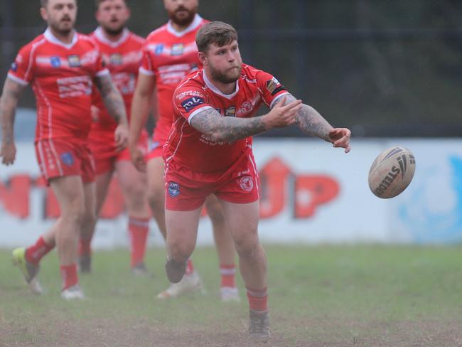 Baden Stewart fires off a pass for East Campbelltown Eagles. Picture: Steve Montgomery