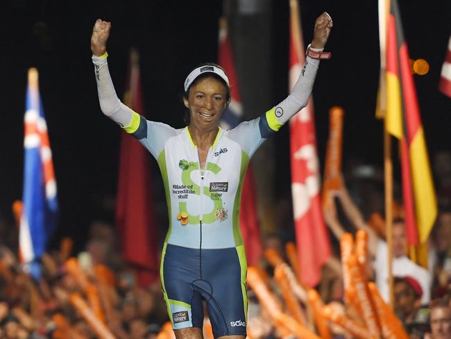 Bush fire survivor Turia Pitt, of Australia, finishes the Ironman World Championship Triathlon, Saturday, Oct. 8, 2016, in Kailua-Kona, Hawaii. (AP Photo/Mark J. Terrill)