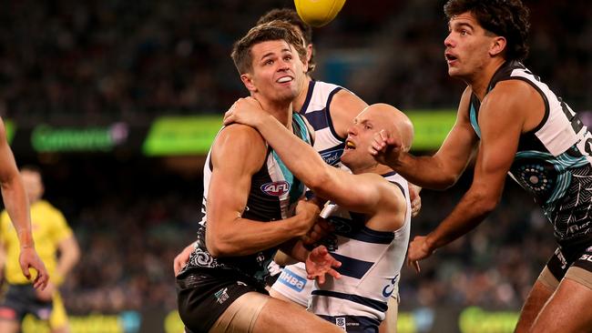 Port Adelaide’s Ryan Burton tackles Geelong’s Gary Ablett during the Round 14 match at Adelaide Oval. Picture: James Elsby/AFL Photos via Getty Images.