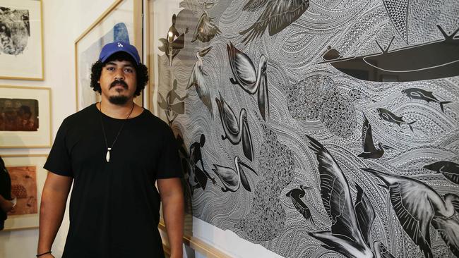 Cairns artist Daniel O'Shane a lino prints on display at the Cairns indigenous Arts Fair. Picture: BRENDAN RADKE