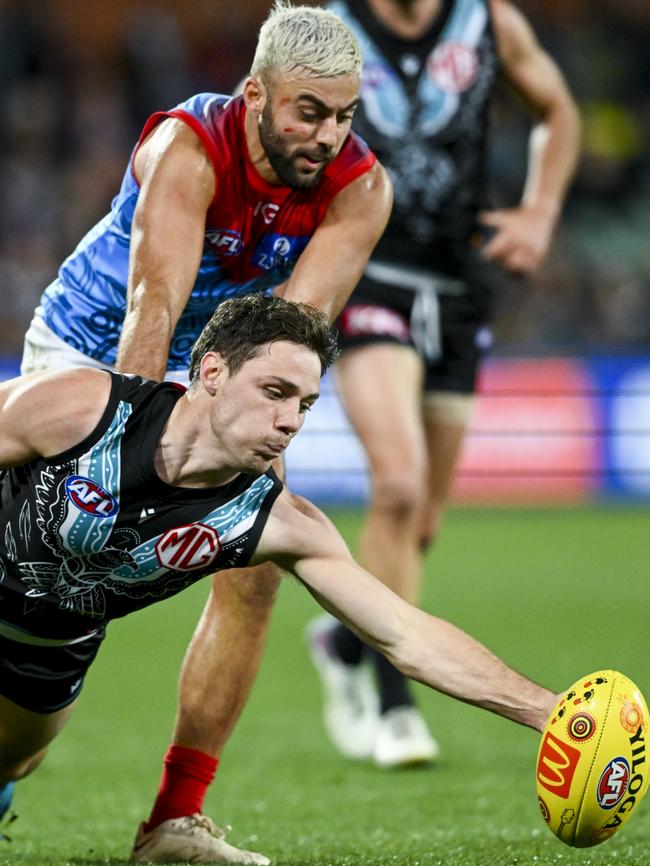 McEntee takes possession in front of Melbourne’s Christian Salem. Picture: Mark Brake/Getty Images