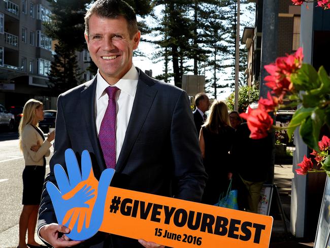 Premier Mike Baird with sign Giveyourbest in Manly involved with the DoSomthing campaign, pictured outside Manly Community Centre.