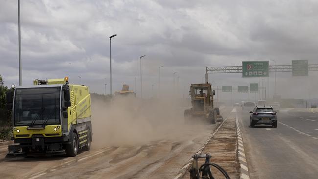 TEL AVIV, ISRAEL - MAY 4: Tractors work as they clean a road after a ballistic missile fired from Yemen by the Houthi struck a field near Israel's International airport Ben Grunion on May 4, 2025 in Tel Aviv, Israel. Israeli officials have said that a ballistic missile which landed close to the country's main international airport on Sunday was fired by the Iran-backed Houthi rebel group in Yemen. Eight people were injured, according to emergency services, and air traffic at Ben Gurion Airport was temporarily halted. The Houthis, who have escalated a campaign against Israel in opposition to the blockade of aid to Gaza, confirmed the attack in a televised statement. (Photo by Amir Levy/Getty Images)