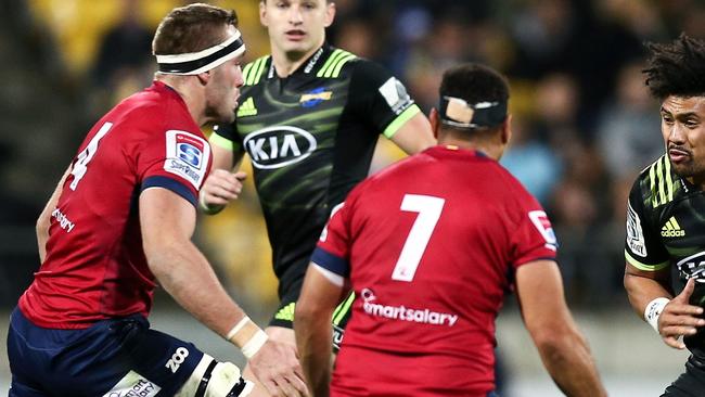 WELLINGTON, NEW ZEALAND - MAY 18:  Ardie Savea of the Hurricanes runs at George Smith and Izack Rodda of the Reds during the round 14 Super Rugby match between the Hurricanes and the Reds at Westpac Stadium on May 18, 2018 in Wellington, New Zealand.  (Photo by Hagen Hopkins/Getty Images)