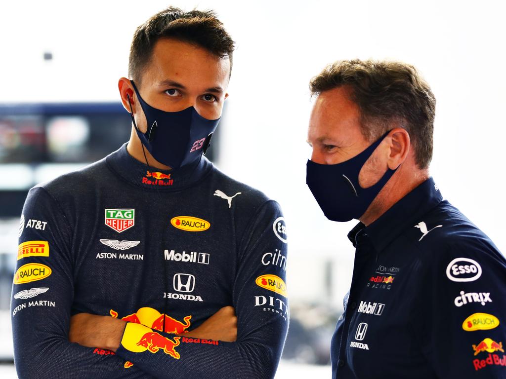 Alexander Albon of Thailand and Red Bull Racing Team Principal Christian Horner.