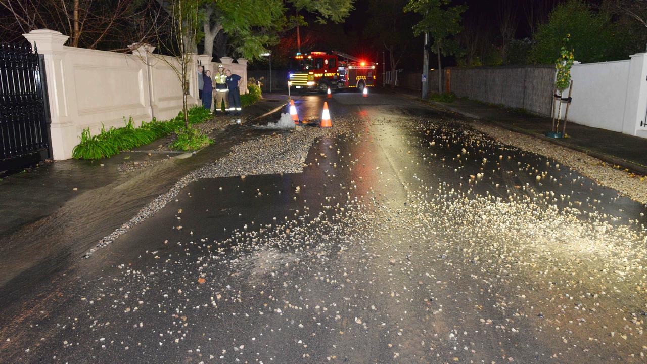 Scattered gravel on Grove St after the water main burst. Picture: Brenton Edwards