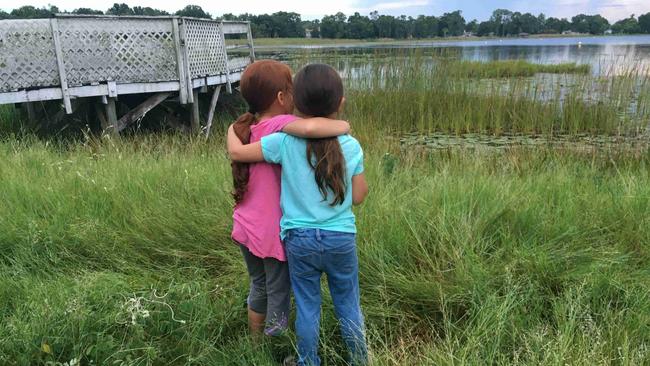 Jancey (Valeria Cotto) and Moonee (Brooklynn Prince) take a break from their non-stop mischief-making in The Florida Project.