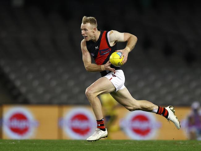 AFL Round 21. Western Bulldogs vs Essendon at Marvel Stadium, Melbourne.  08/08.2021.   Nick Hind of the Bombers charges through the middle during the 2nd qtr.     .  Pic: Michael Klein