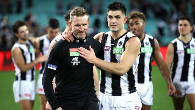 Nathan Buckley walks off the MCG last year with Brayden Maynard when he was still the Magpies’ coach. Picture: Phil Hillyard