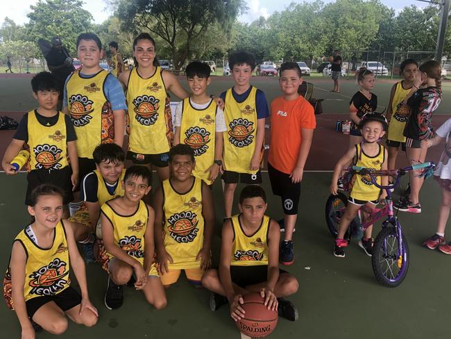 Territory superstar basketball player Abby Cubillo with kids she coached at the Hoops 4 Health clinic in Karama on Monday. Picture: Hoops 4 Health