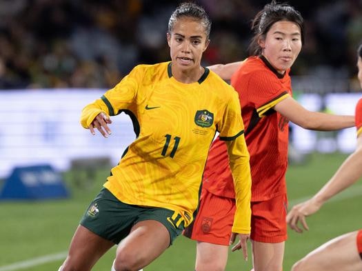 SYDNEY, AUSTRALIA - JUNE 3: Mary Fowler of Australia breaks through the challenge of China's Menglu Shen during the international friendly match between Australia Matildas and China PR at Accor Stadium on June 3, 2024 in Sydney, Australia. (Photo by Steve Christo - Corbis/Corbis via Getty Images)