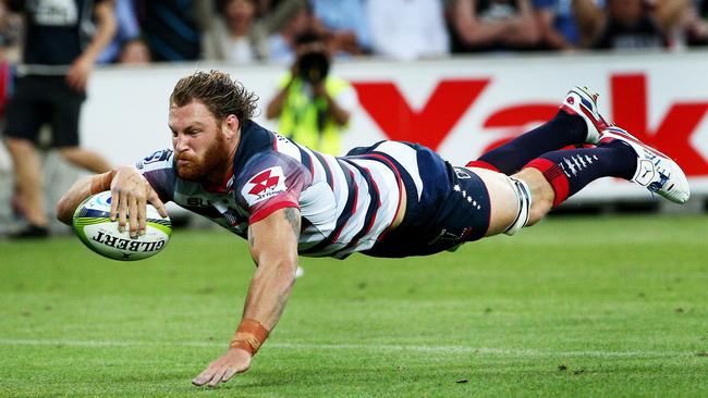 Scott Higginbotham scores against the Waratahs.