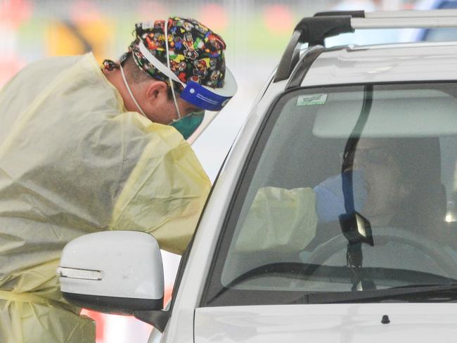 ADELAIDE, AUSTRALIA - NewsWire Photos JULY 01, 2021 -  Lines of cars and health workers at the Victoria Park Covid testing clinic in Adelaide. Picture: NCA NewsWire / Brenton Edwards