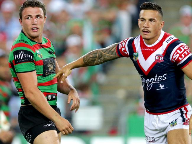 South Sydney's Sam Burgess and Rooster's Sonny Bill Williams during the South Sydney Rabbitohs v Sydney Roosters 2014 season opening game at ANZ Stadium,Homebush .Picture Gregg Porteous