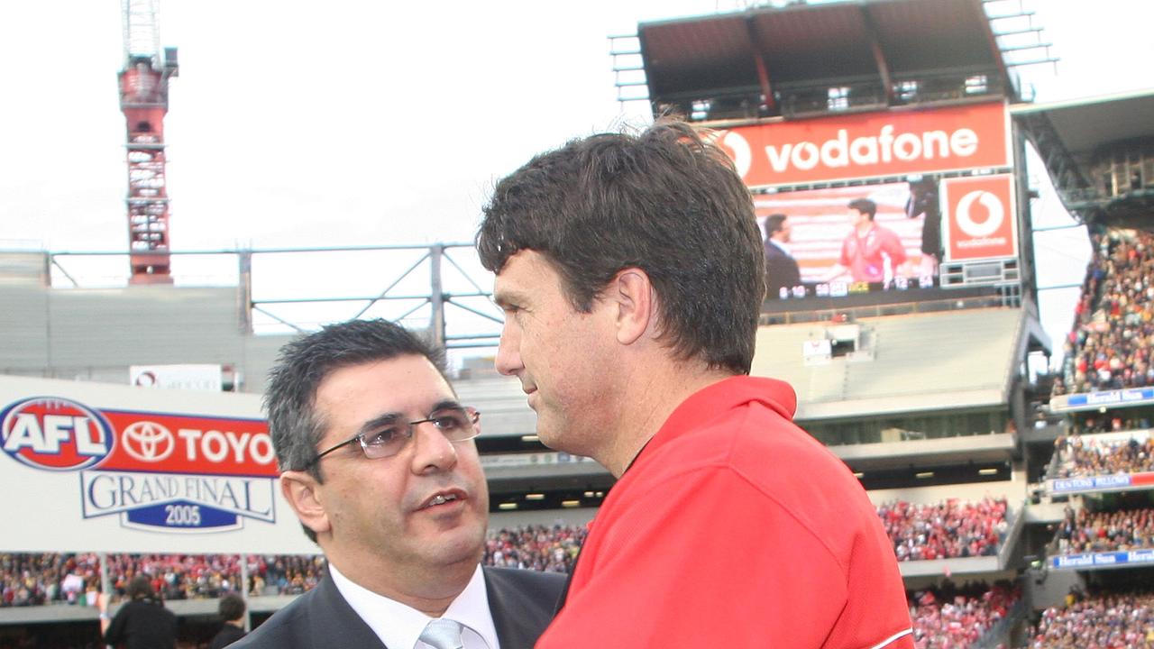 MELBOURNE, AUSTRALIA - SEPTEMBER 24: Swans Coach Paul Roos shakes hands with AFL CEO Andrew Demetriou after the 2005 AFL Grand Final between the Sydney Swans and the West Coast Eagles at the Melbourne Cricket Ground September 24, 2005 in Melbourne, Australia. (Photo by Quinn Rooney/Getty Images)