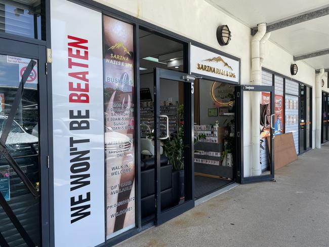 Despite missing glass, Sarina Nail and Spa was open on Saturday October 19, after an alleged axe rampage through the town the previous night. Picture: Fergus Gregg