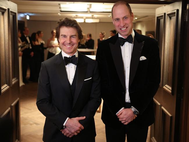 Prince William joked that he wasn’t wearing his Top Gun slippers as he posed with Tom Cruise at the London Air Ambulance Charity Gala Dinner. Picture: AFP