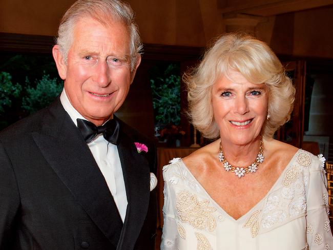 A handout picture released by Clarence House on December 18, 2017 shows Britain's Prince Charles, Prince of Wales (L) and Britain's Camilla, Duchess of Cornwall (R) posing in the Orchard Room during the private 70th birthday party of The Duchess of Cornwall at Highgrove House near Tetbury in southwest England on July 15, 2017.  This photograph of their Royal Highnesses posing at the Duchess of Cornwall's birthday party was used as the royal couple's 2017 Christmas card. / AFP PHOTO / CLARENCE HOUSE / Hugo BURNAND / RESTRICTED TO EDITORIAL USE - MANDATORY CREDIT "AFP PHOTO / CLARENCE HOUSE / HUGO BURNAND" - NO MARKETING NO ADVERTISING CAMPAIGNS - RESTRICTED TO SUBSCRIPTION USE - STRICTLY NO SALES - DISTRIBUTED AS A SERVICE TO CLIENTS