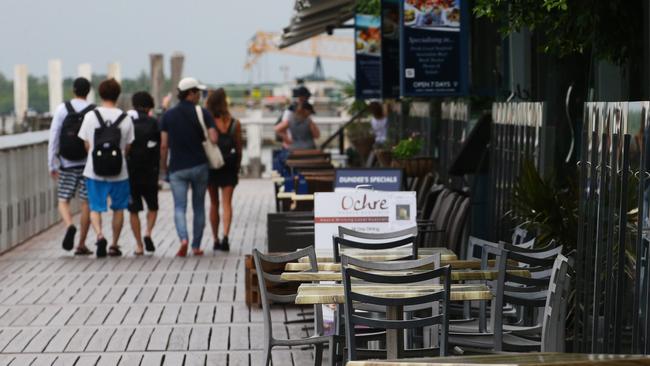 Restaurant tables on the Cairns waterfront sit empty as tourist numbers fall and tourism related businesses suffer a loss of income. Picture: Brendan Radke