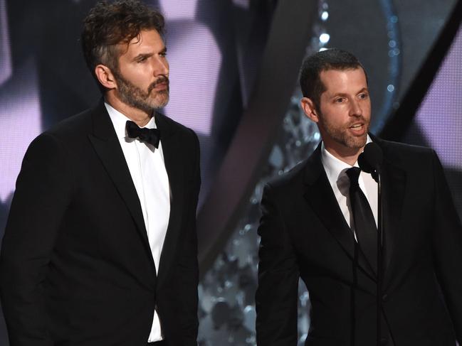 (FILES) In this file photo taken on September 18, 2016 writer and producers David Benioff (L) and D.B. Weiss accept the Outstanding Writing for a Drama Series for "Game of Thrones" episode Battle of the Bastards during the 68th Emmy Awards show in Los Angeles.  Lucasfilm announced plans Tuesday for a new series of "Star Wars" films made by Benioff and Weiss as it seeks to build on the lucrative sci-fi franchise. The creators of the smash-hit, Emmy Award-winning "Game of Thrones," will write and produce new films that are separate from the main Skywalker saga and the trilogy  / AFP PHOTO / Valerie MACON