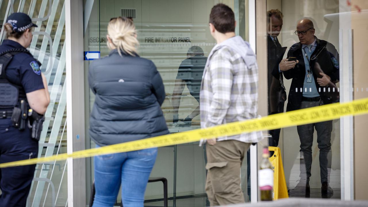Police, detectives and crime scene investigators examine the building after the attack. Picture: Emma Brasier