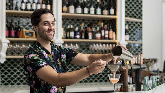 Gibson Hibbins shakes things up behind the bar. Picture: Monique Harmer