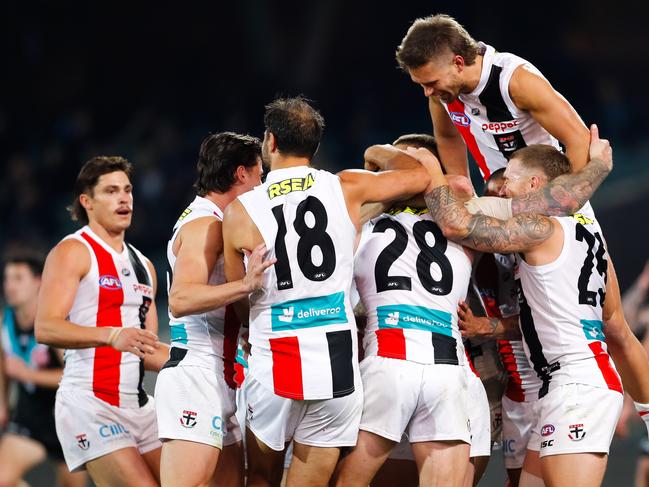 Teammates rush to Tim Membrey after his freakish goal against Port Adelaide.