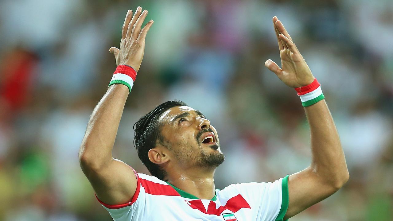 MELBOURNE, AUSTRALIA - JANUARY 11: Reza Ghoochannejhad of Iran gestures after having a goal ruled offside during the 2015 Asian Cup match between IR Iran and Bahrain at AAMI Park on January 11, 2015 in Melbourne, Australia. (Photo by Quinn Rooney/Getty Images)
