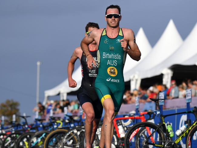 Jake Birtwhistle passes Jonathan Brownlee in the finishing straight to seal seventh place in the World Triathlon Series grand final on the Gold Coast and ensure an overall podium placing. Photo: Delly Carr Triathlon Australia