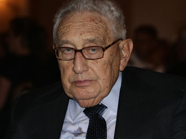 Old Jon Kissinger enjoys another diplomatic dinner.