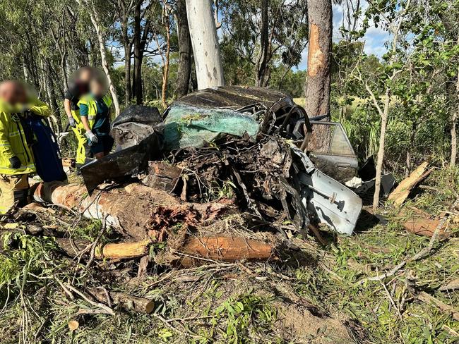 Emergency services at the scene of an accident at Greenlake Rd, Sandringham near Rockhampton where a young man's car rolled and collided with a tree on February 27, 2025, leaving him trapped and suffering life-threatening injuries.