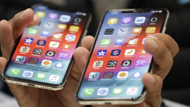 The iPhone XS, left, and XS Max are displayed side to side during an event to announce new products at Apple headquarters Wednesday, Sept. 12, 2018, in Cupertino, Calif. (AP Photo/Marcio Jose Sanchez)