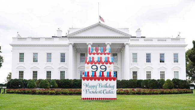 A sign wishing a happy birthday to former US President Jimmy Carter sits on the North Lawn of the White House in Washington, DC. Picture: AFP