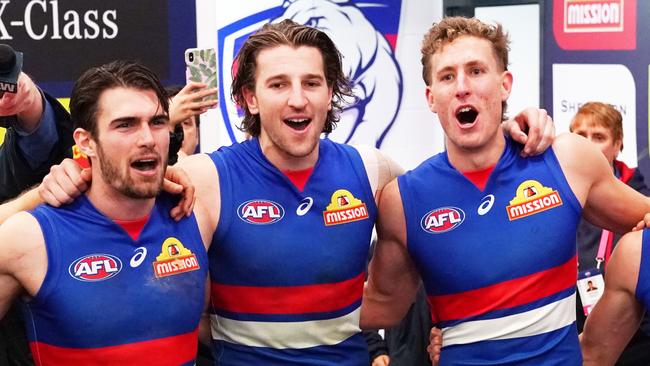 Easton Wood, Marcus Bontempelli and Aaron Naughton enjoy a win. Picture: AAP