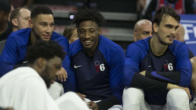 Ben Simmons (L) jokes with fellow 76ers stars Robert Covington, Dario Saric and Joel Embiid (foreground). Picture: Getty Images