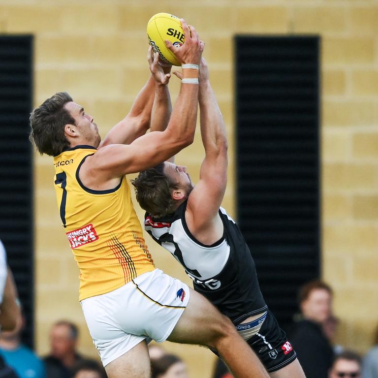 Riley Thilthorpe clunks a mark over Trent McKenzie. Picture: Getty Images