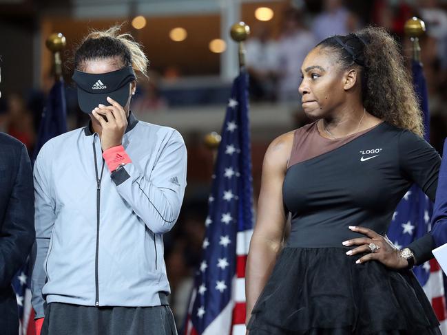 Tennis player Serena Williams competes in the women's singles finals at the 2018 U.S. Open in Flushing NY on September 8, 2018. Naomi Osaka defeated Serena Williams. 08 Sep 2018 Pictured: (L-R) Tennis players Naomi Osaka hides her face and Serena Williams comforts her during the trophy presentation ceremony at the 2018 U.S. Open in Flushing NY on September 8, 2018. (Photo by Andrew Schwartz)//SCHWARTZANDREW_TENNIS0023/Credit:Andrew Schwartz/SIPA/1809091205. Photo credit: Andrew Schwartz/SIPA / MEGA  TheMegaAgency.com +1 888 505 6342