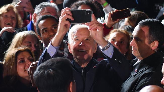 US President Joe Biden takes a selfie with supporters at a campaign rally in Arlington, Virginia, on Wednesday. Picture: AFP