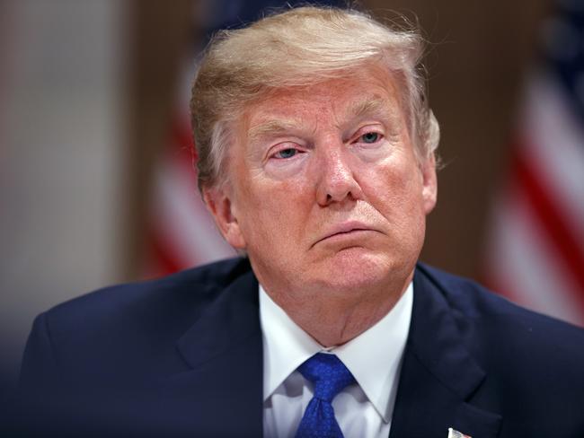 President Donald Trump listens during a dinner with European business leaders at the World Economic Forum, Thursday, Jan. 25, 2018, in Davos. (AP Photo/Evan Vucci)