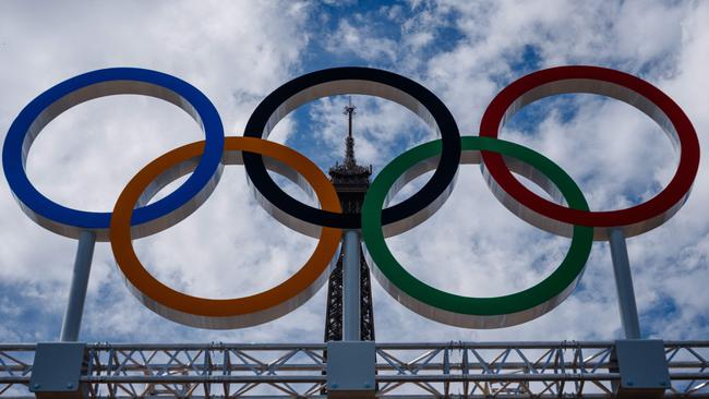 The Olympic Rings displayed at the construction site of the Eiffel Tower Stadium for the upcoming Paris 2024 Olympics and Paralympic Games. Picture: AFP