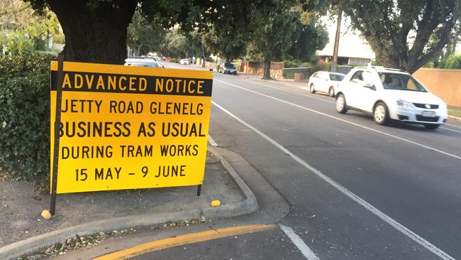 A sign on Moseley St with the “business as usual” message. Picture: Eugene Boisvert