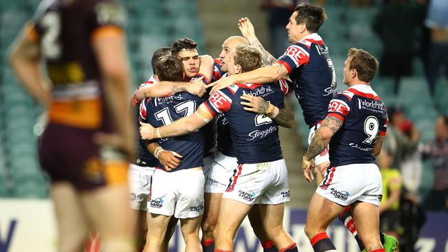 SYDNEY, AUSTRALIA — SEPTEMBER 08: Latrell Mitchell of the Roosters celebrates with his team mates after scoring a try during the NRL Qualifying Final match between the Sydney Roosters and the Brisbane Broncos at Allianz Stadium on September 8, 2017 in Sydney, Australia. (Photo by Mark Kolbe/Getty Images)