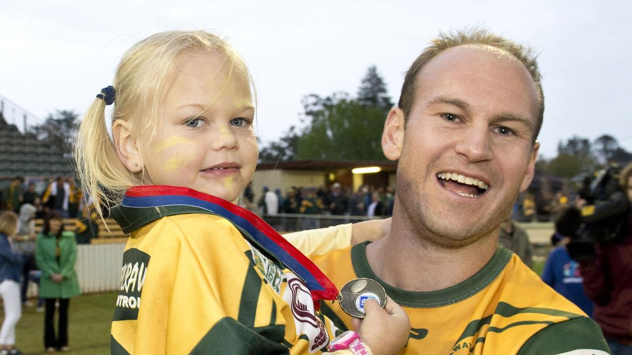 Robbie Moore and daughter. TRL grand final, Wattles vs Gatton. Sunday, Sep 07, 2014. Photo Nev Madsen / The Chronicle