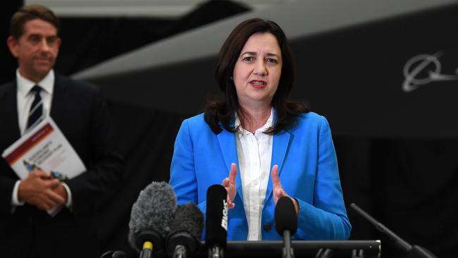 Queensland Premier Annastacia Palaszczuk, flanked by Treasurer Cameron Dick, on Monday. Picture: Dan Peled